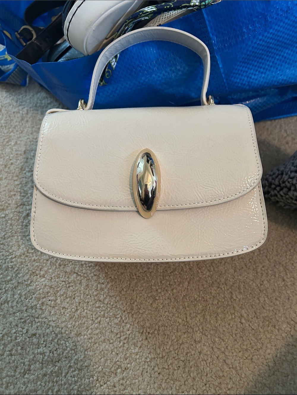 Dolce Vita Elegant cream patent top -Handle Women's Bag with Gold Accent